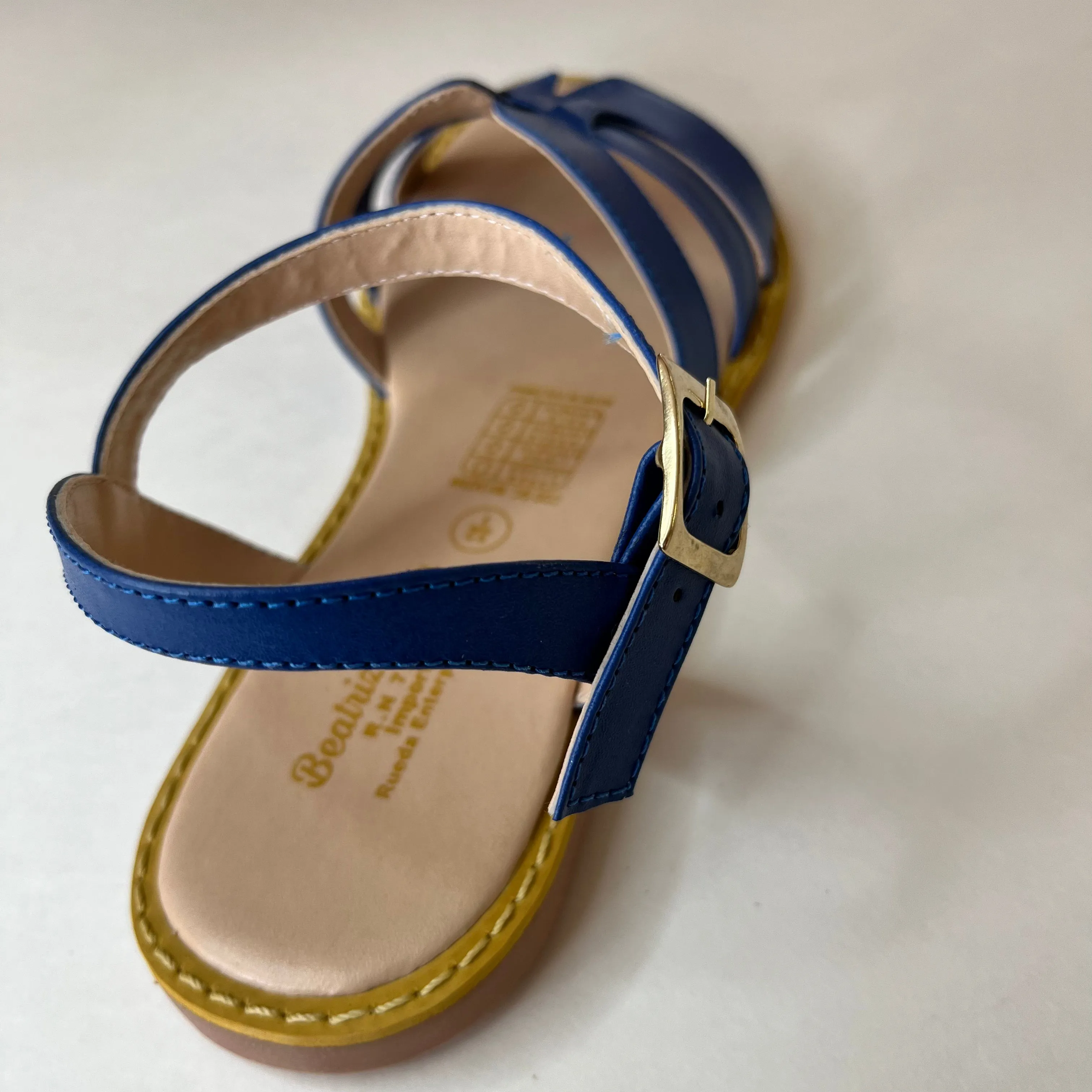 Blue leather sandal with straps in front
